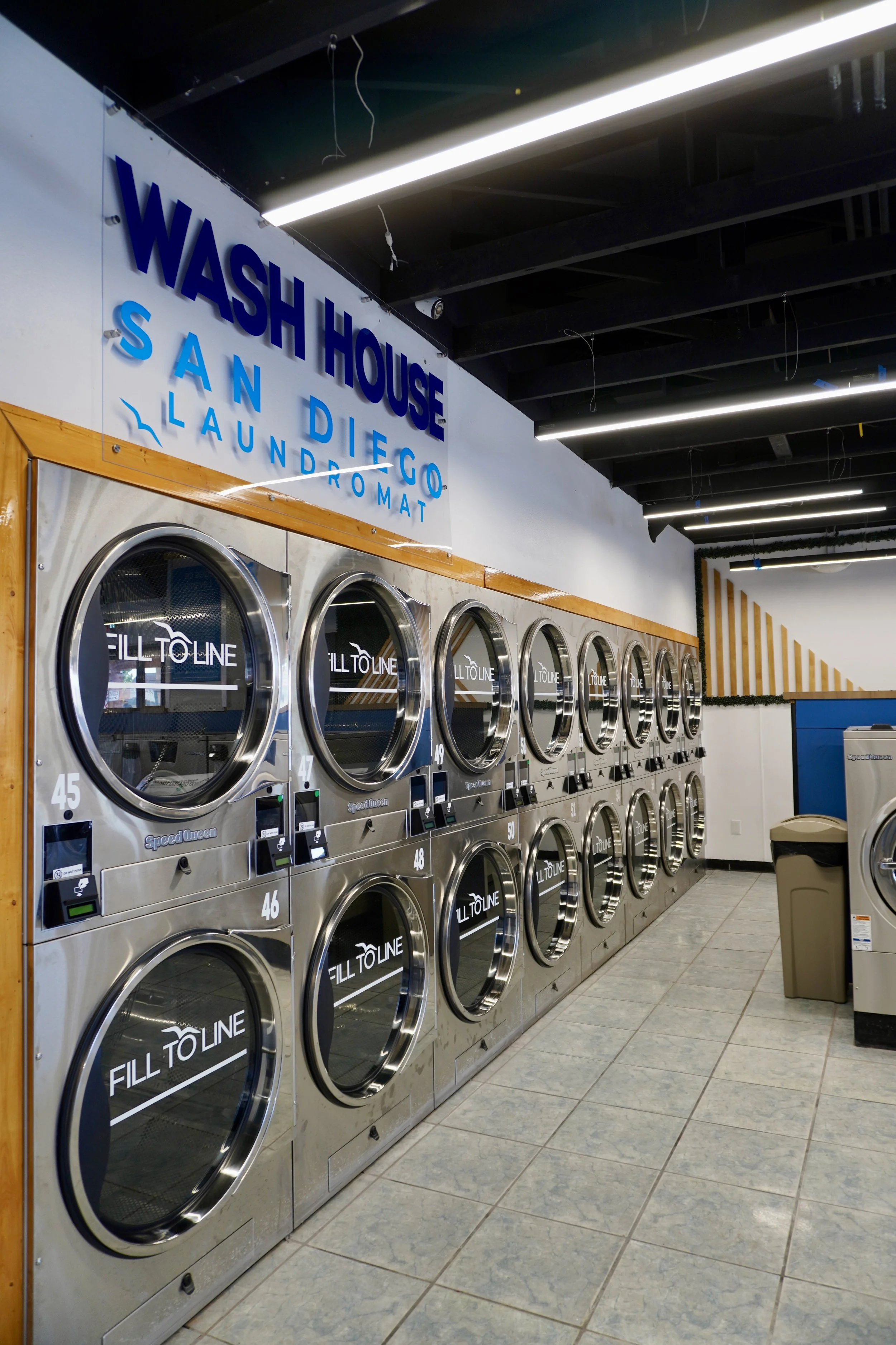 THE WASH HOUSE laundromat interior in San Diego showing clean, modern laundry machines and facilities
